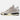 Der Nike Air Jordan 4 A Ma Maniere Fossil ist ein beige- und cremefarbener Sneaker mit Mesh- und Wildlederdetails, sichtbarer Luftpolsterung in der Sohle und schwarzen und kastanienbraunen Akzenten an der Ferse und der Außensohle.