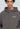 Eine Person, die den LowLights Men Basic Zip Hoodie in verwaschenem Grau mit einem kleinen weißen "Lowlights"-Logo auf der linken Brust trägt, steht vor einem schlichten hellen Hintergrund.