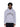 Ein Mann, der den grauen NoByStanders Patchwork Hoodie mit dem schwarz-weißen Schriftzug "Bystanders" trägt, steht vor einem schlichten weißen Hintergrund.